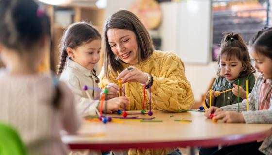 An educator with pre-school kids