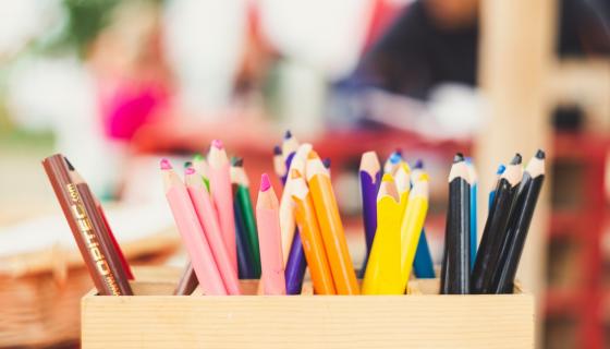 Coloured pencils on a desk 