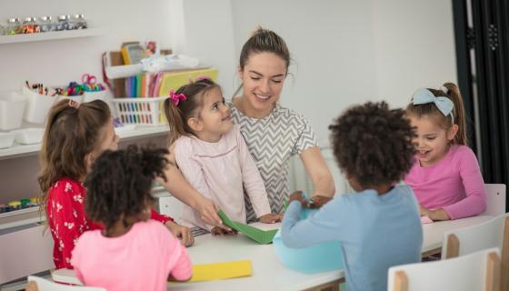 Childcare educator with children 