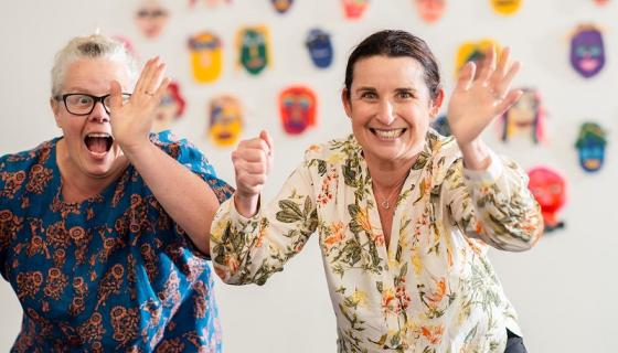 Teachers wearing colour shirts at an art workshop